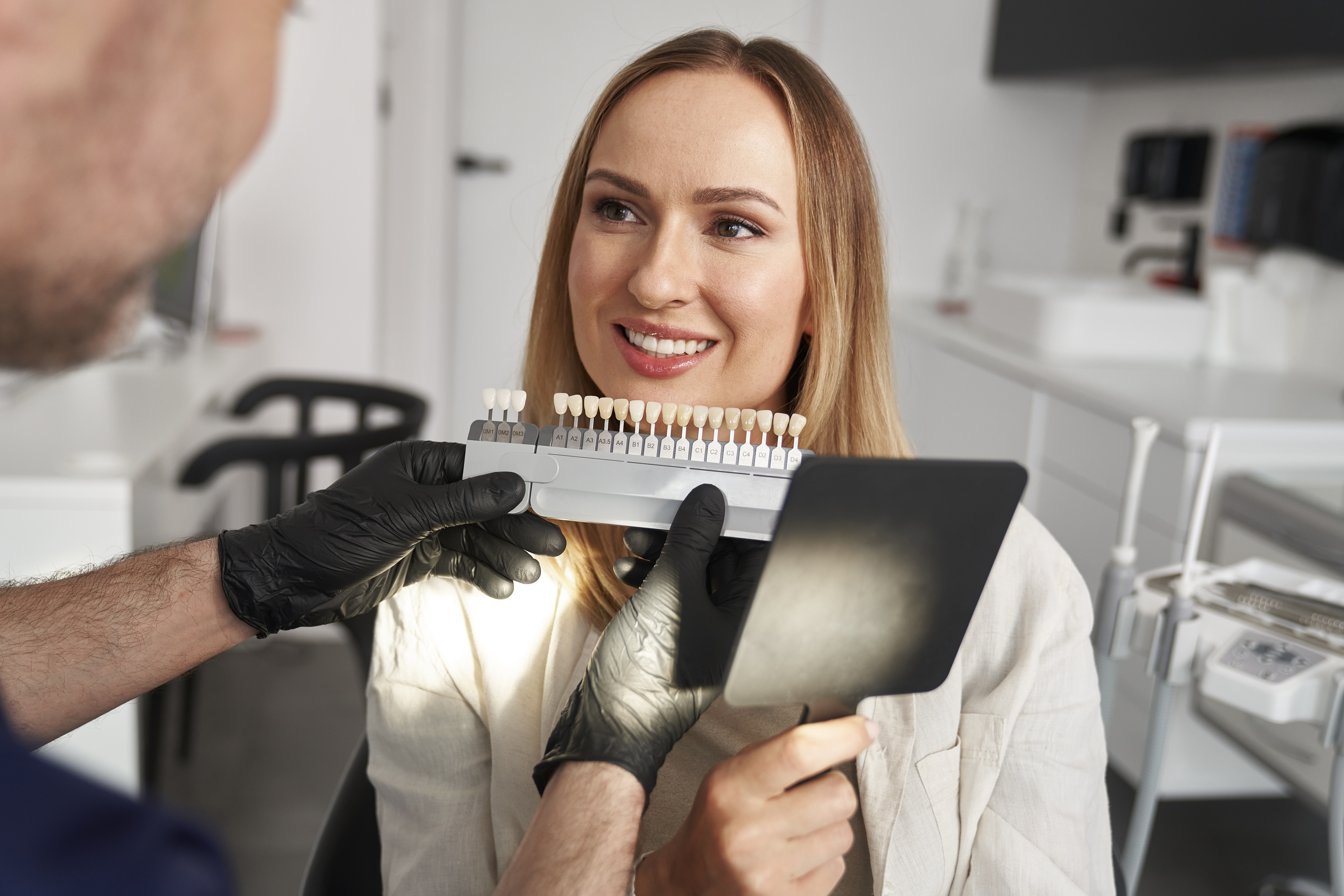 Woman having cosmetic veneers at dentist’s office