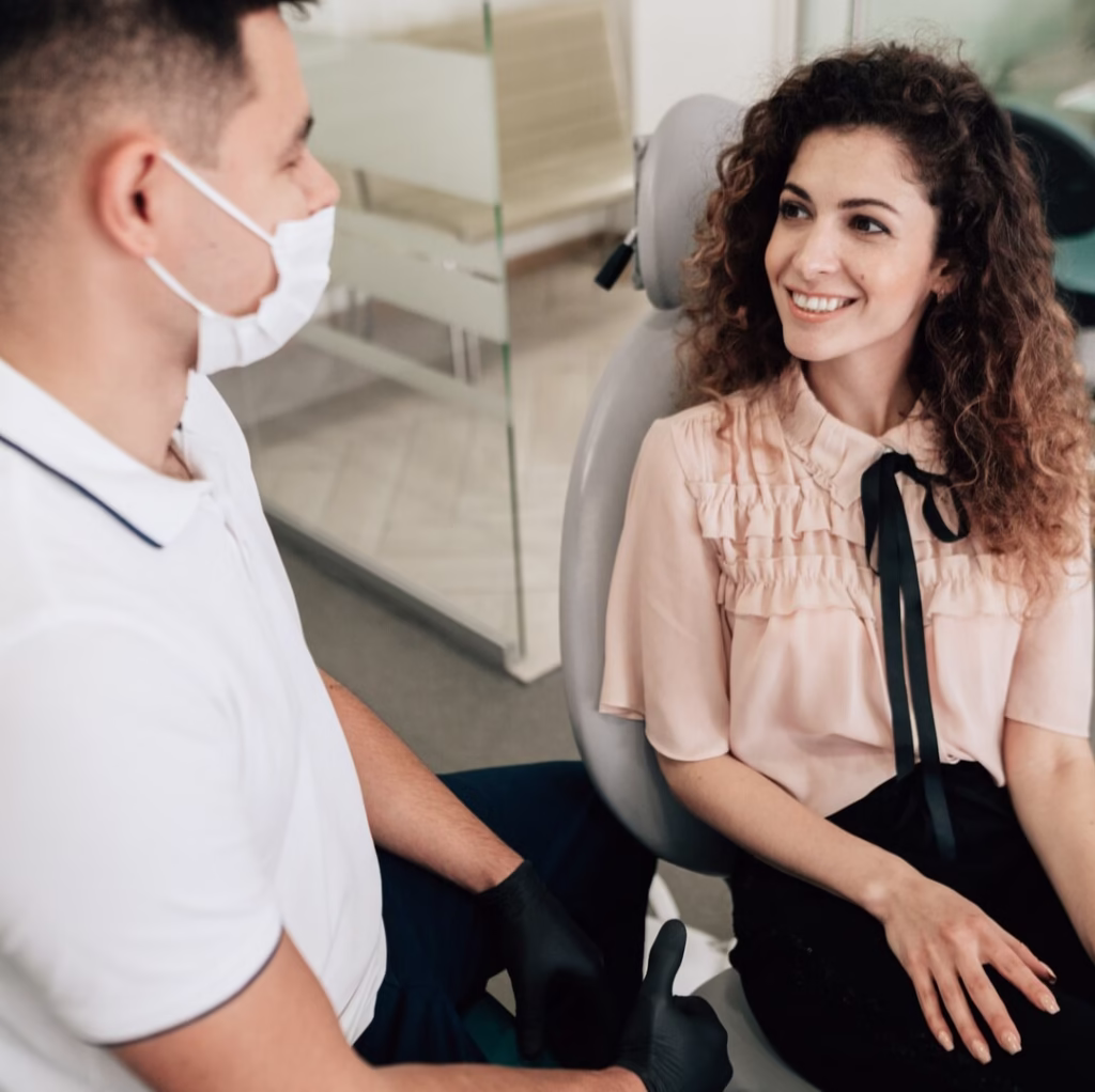 Patient in consultation room with Endodontist dubai for root canal treatment